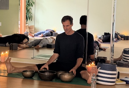 Raji playing Tibetan singing bowls.