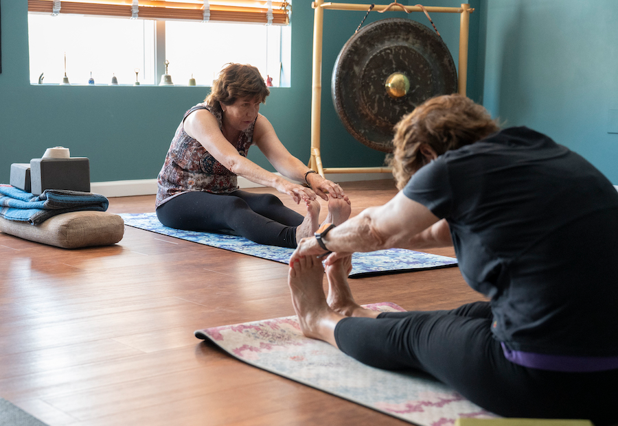 Forward bends in a yogs class.